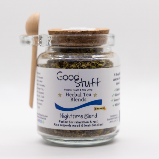 Glass jar including a wooden spoon full of an nighttime herbal blend made from Skullcap, Valerian Root, Soursop Leaves, and Wild Lettuce. All alkaline, organic, electric, and vegan.